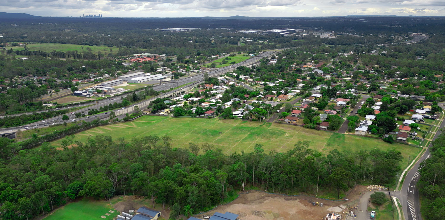 Aerial view of Riverview showing the Riverview Estate site and the Ipswich Motorway, looking towards the city Brisbane